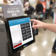 Employee Uses Payroll Deduction at Company Self-Service Kiosk